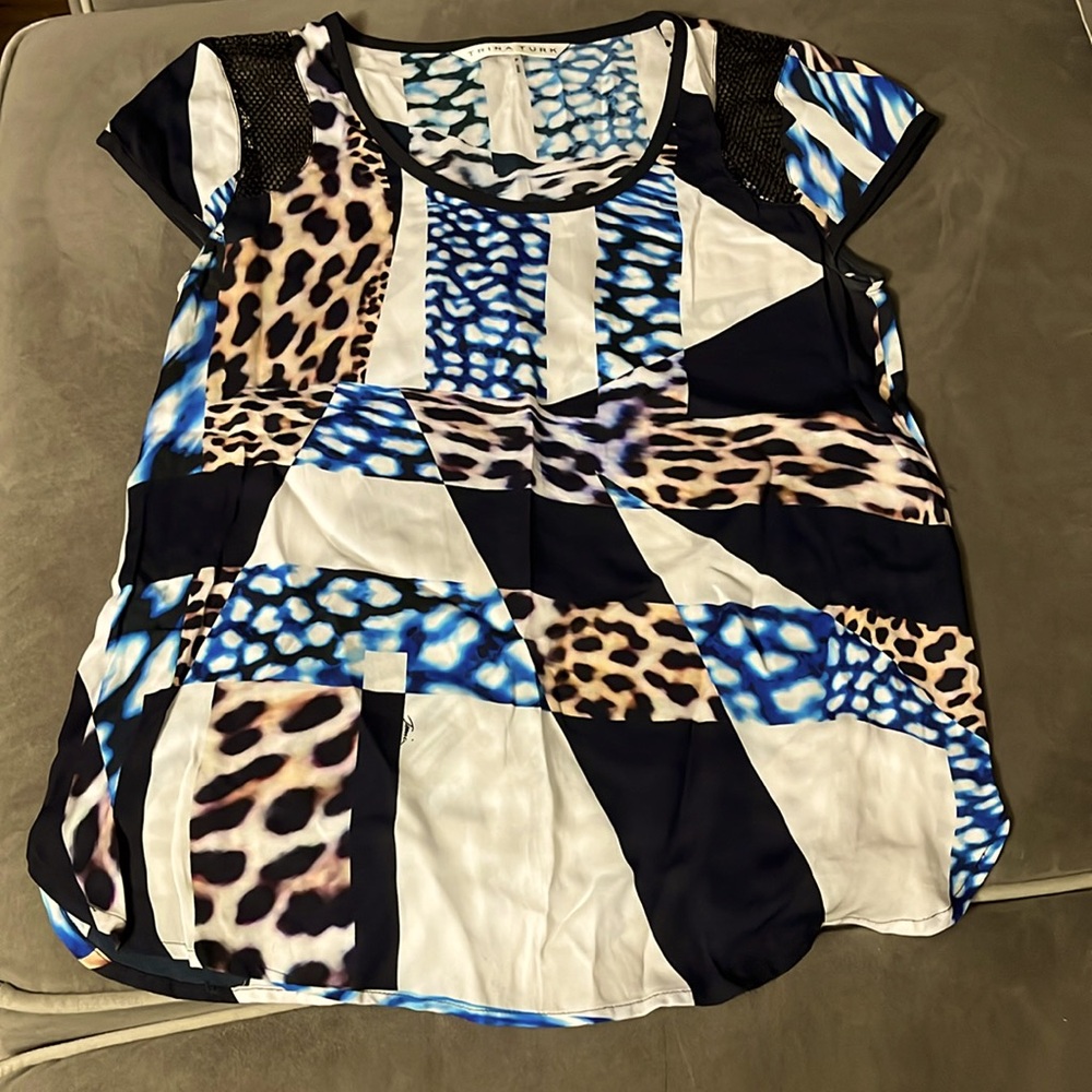 Tina Turk shirt with black trim animal and blue animal print mesh in shoulder